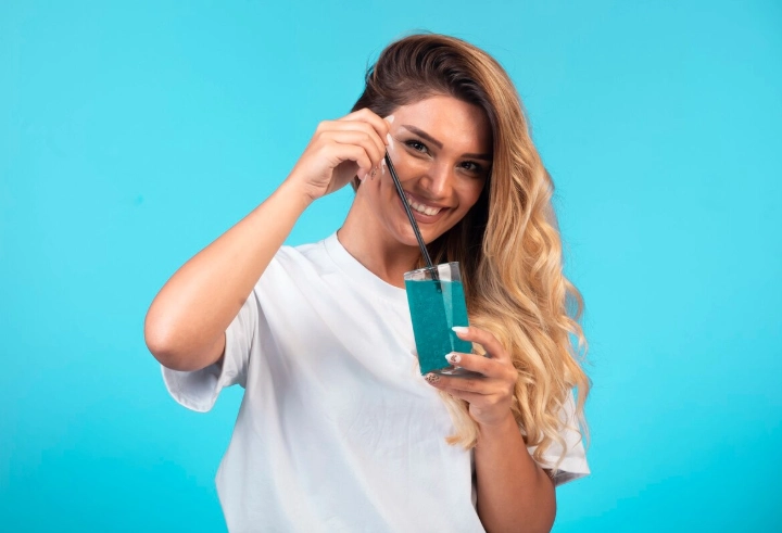 girl with glass of soda