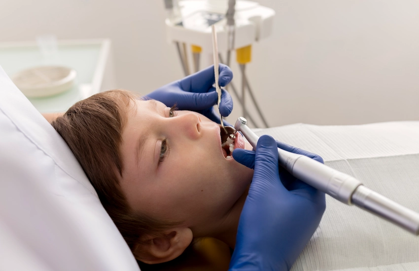how does the extraction of a tooth in kids take place