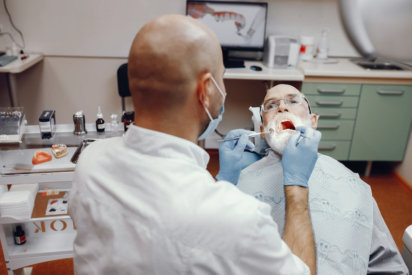 old man sitting dentist s office