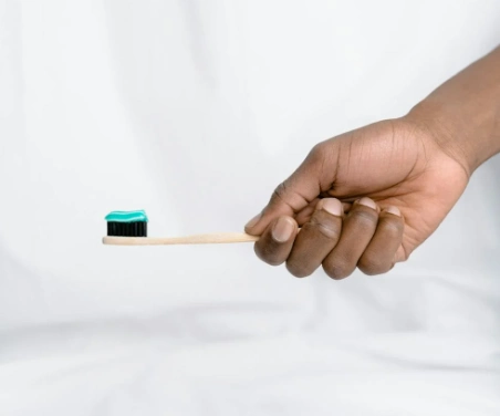 person holding a toothbrush